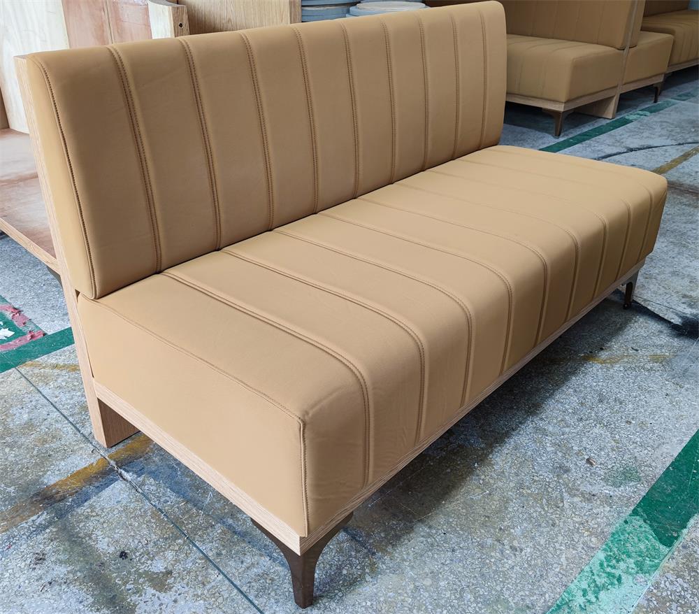 Customizable restaurant booth seating with stain-resistant fabric, designed for comfort and durability in busy spaces.