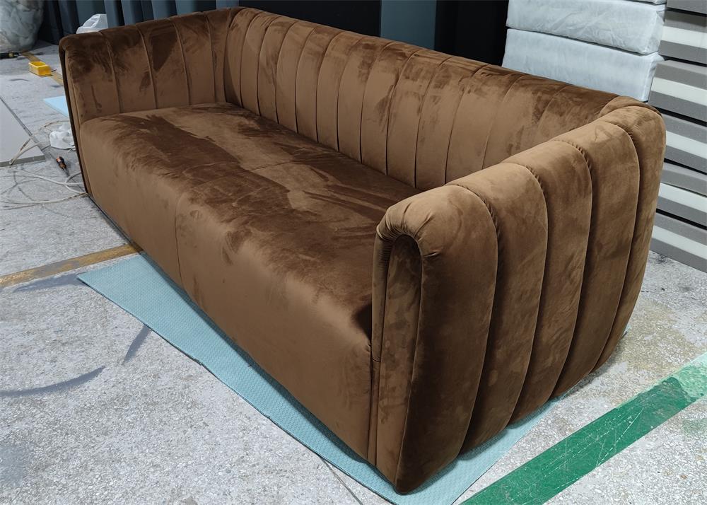 Elegant brown velvet sofa with segmented back and ergonomic design, perfect for commercial lounges and boutique clubs