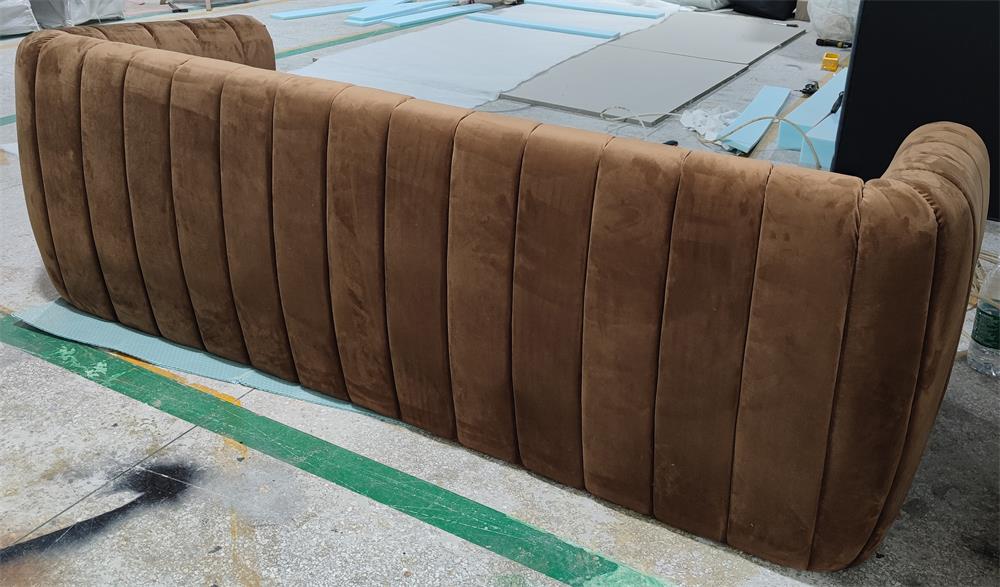 Back view of brown velvet lounge sofa with segmented design, ideal for luxury commercial spaces like lounges and bars