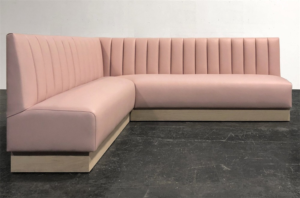L-shaped KTV corner booth sofa, light pink, vertical channel stitching design