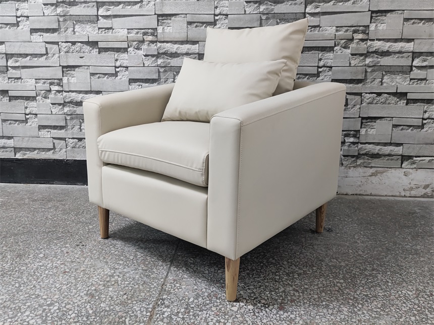 Luxury hotel and bar lounge chair in ivory leather with wooden legs, featuring an ergonomic design, back cushion, and comfortable seating, ideal for commercial spaces such as hotels and bars.