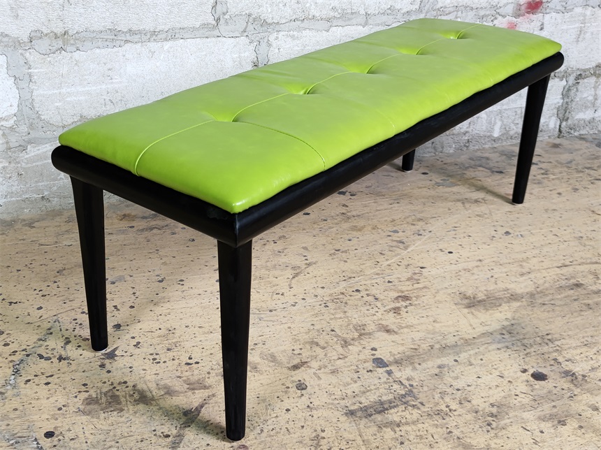 green upholstered bench