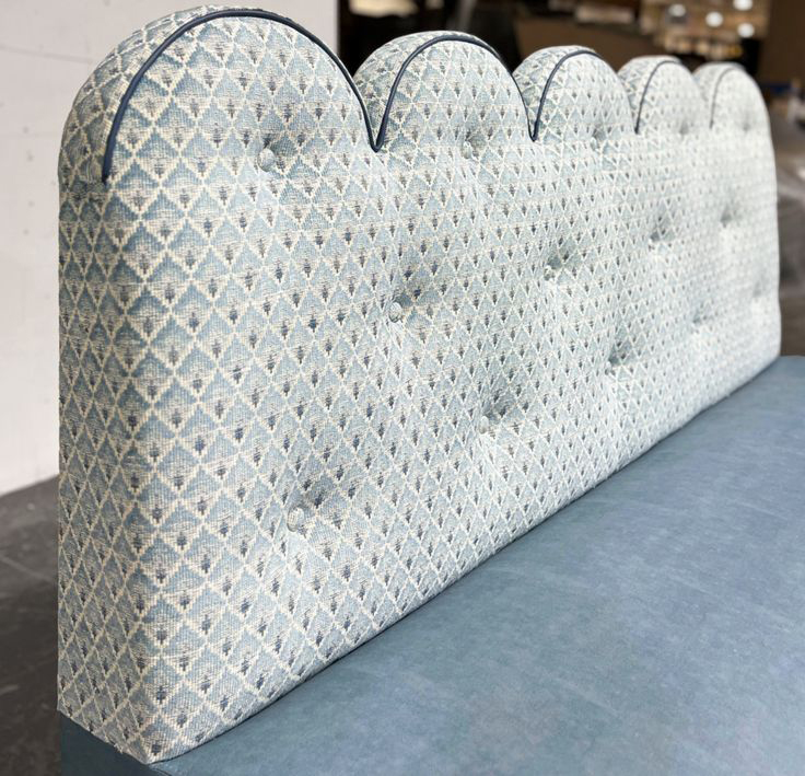 The sofa back has a unique wavy contour