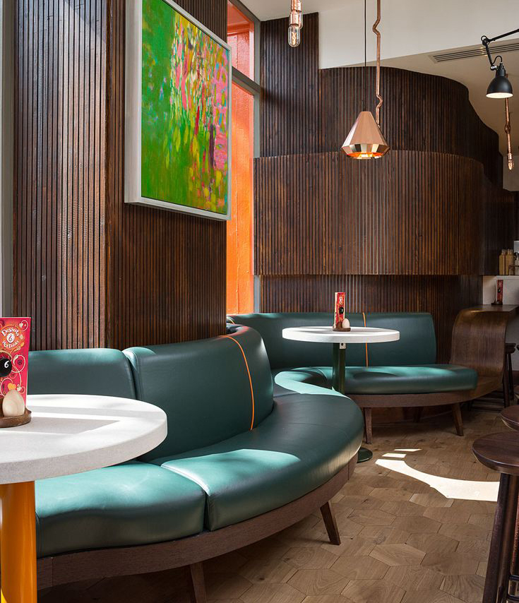 Modern restaurant booth designs maximizing space efficiency in a small dining area