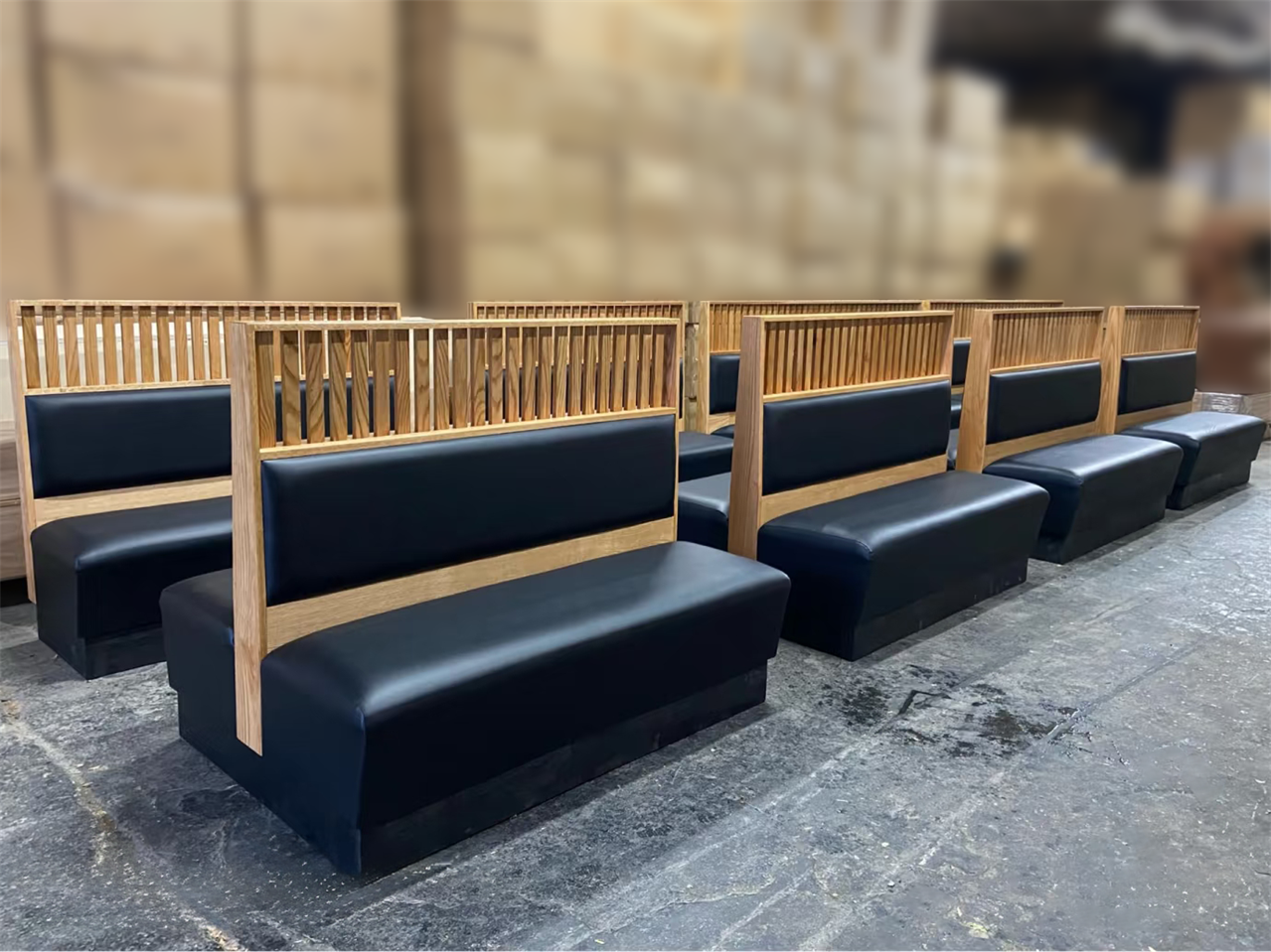 Modern Double-Sided Restaurant Booth with Wood Partition & Black Upholstered Seating