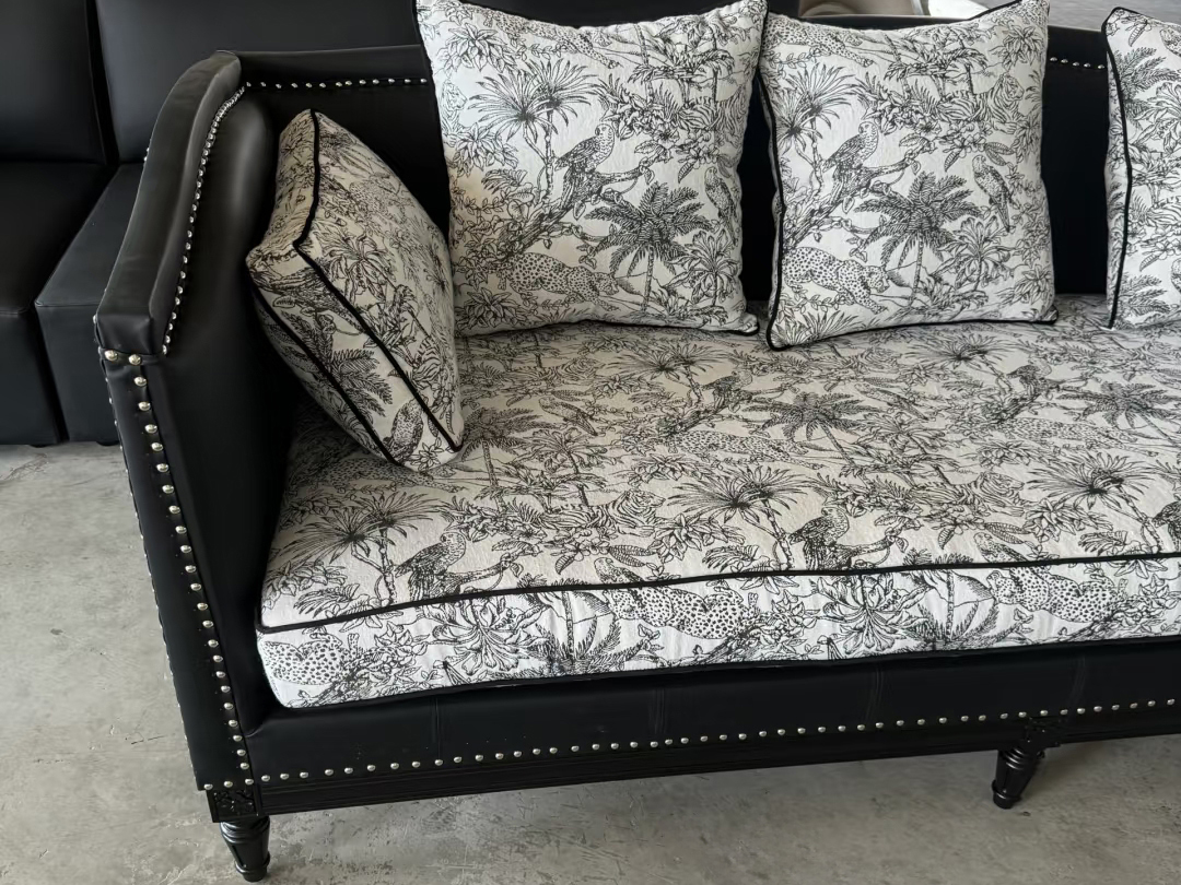 Elegant hospitality seating with floral patterned back pillows