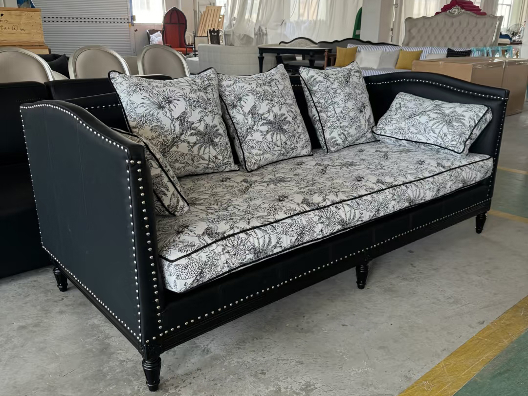 Commercial lounge sofa with curved arms and decorative nailhead trim