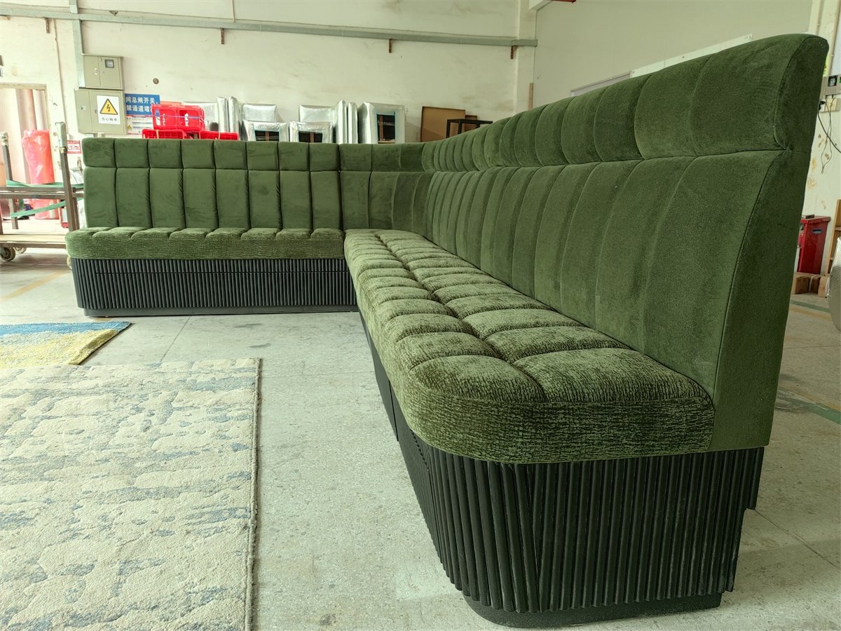 L-shaped velvet booth seating with a tufted backrest and black wood base, designed for hotels and restaurants.